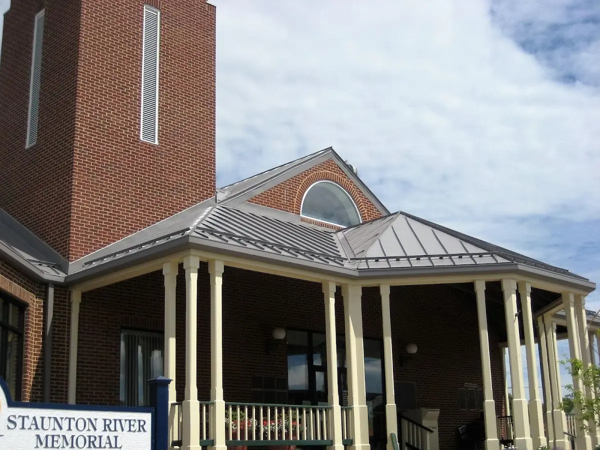 Skilled roofing craftsmen working on a residential roof in Providence